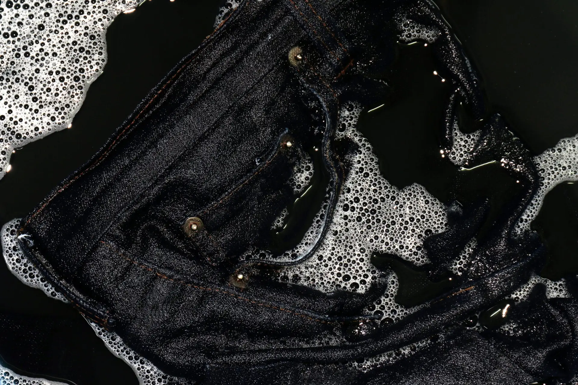 a close up of a black jean