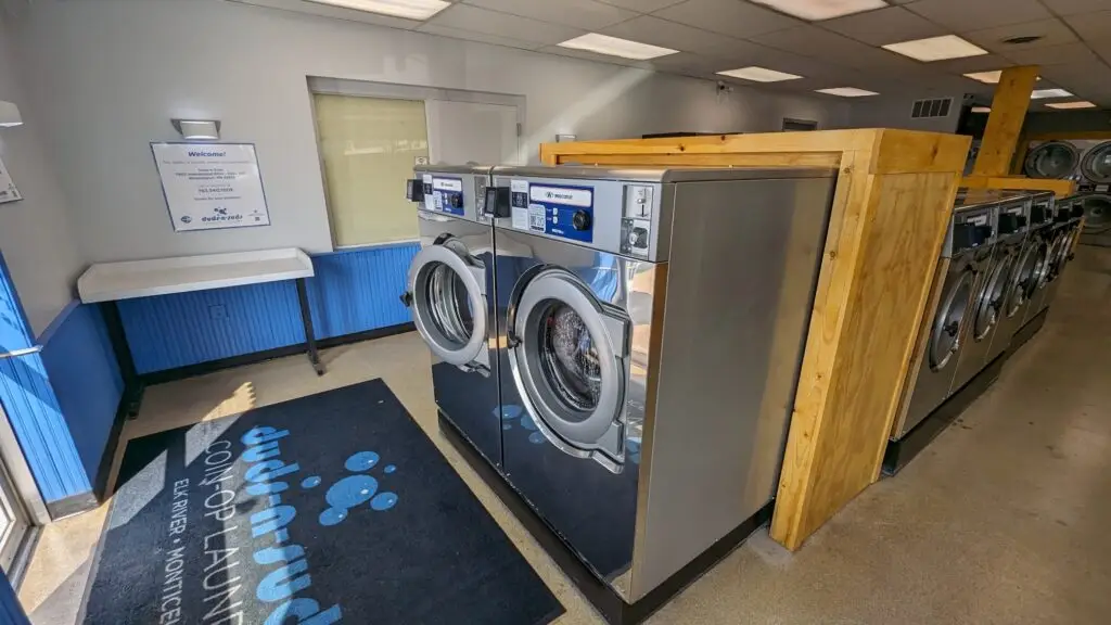 a washing machine in a room - sorting clothes