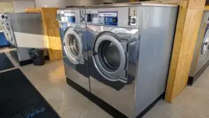a washing machine in a room - Co-op Laundromat